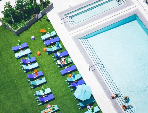 Commercial artificial grass for a hotel by a swimming pool